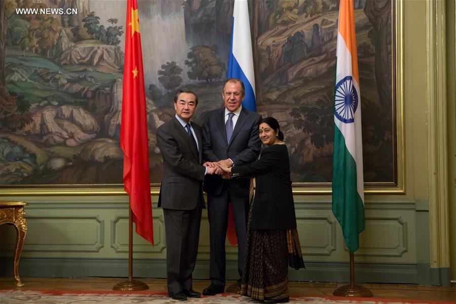 （XHDW）王毅出席中俄印外长第十四次会晤