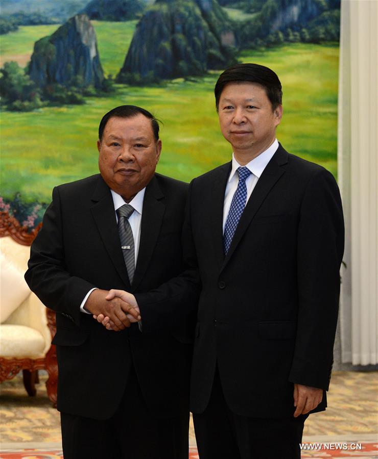 （XHDW）习近平总书记特使宋涛会见老挝人革党中央总书记本扬