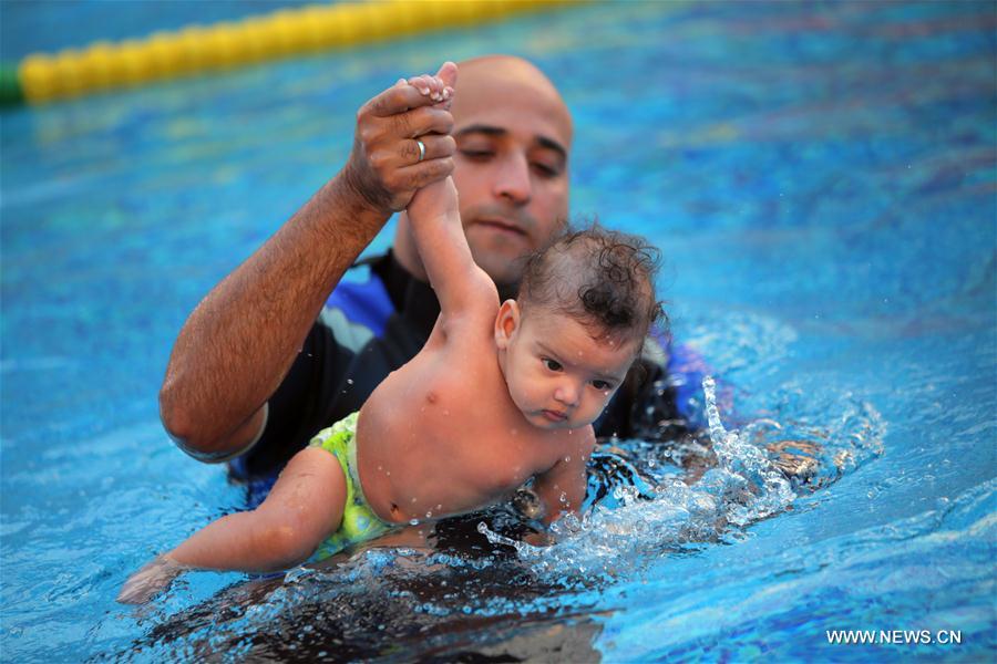 EGYPT-CAIRO-BABY SWIMMING