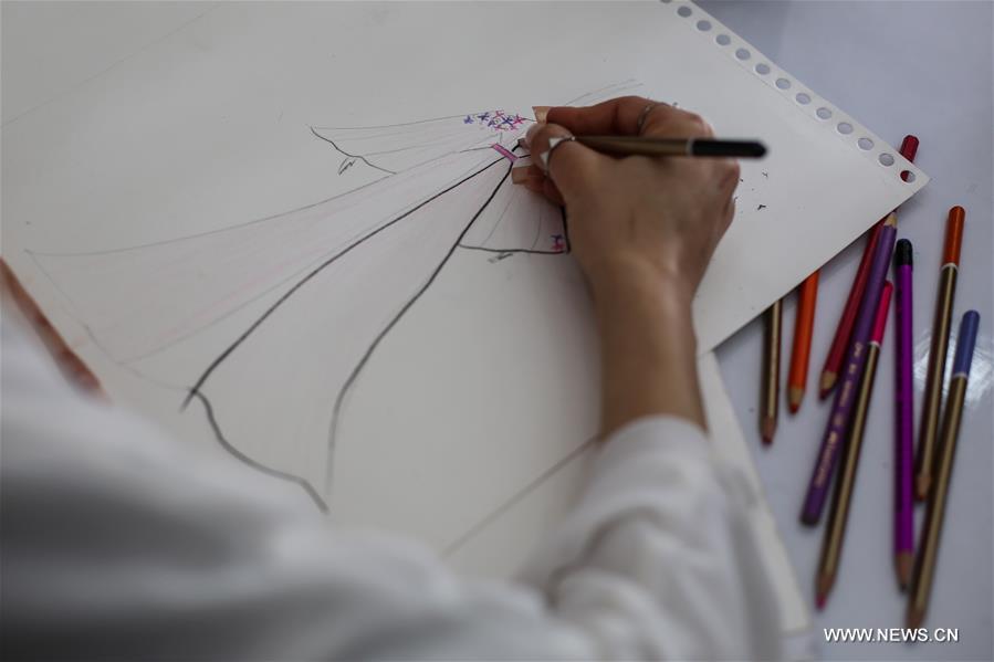 الصورة : مصممة أزياء من غزة 