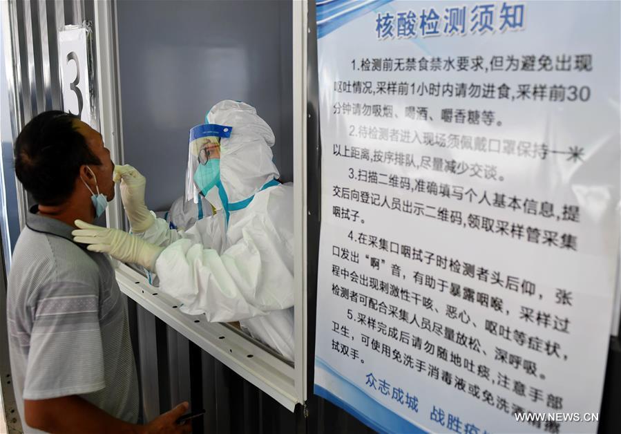 الصورة: اختبار الحمض النووي لكوفيد-19 في بكين