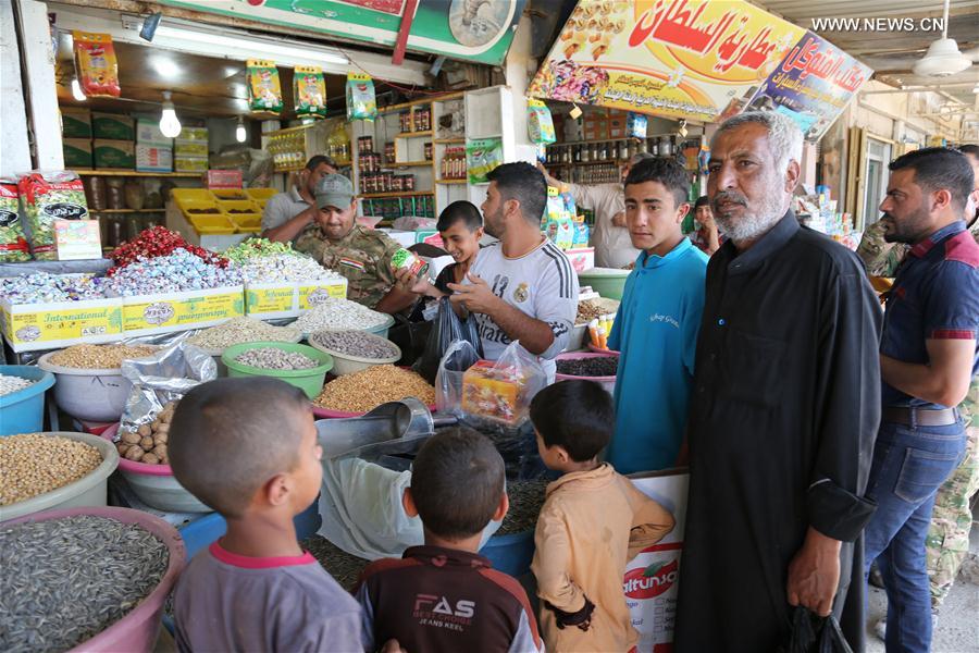 الصورة: لذة خاصة لأول رمضان في الموصل بدون "داعش"