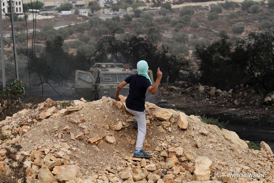 الصورة: اشتباكات إسرائيلية-فلسطينية ضد توسع المستوطنات في الضفة الغربية