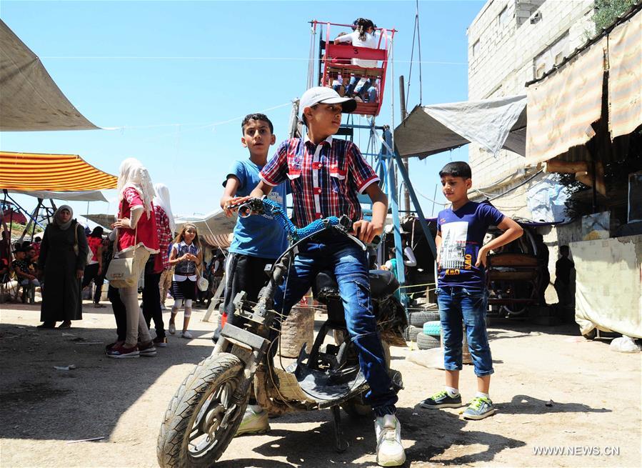 SYRIA-DAMASCUS-CHILDREN-EID AL-FITR-FEAST