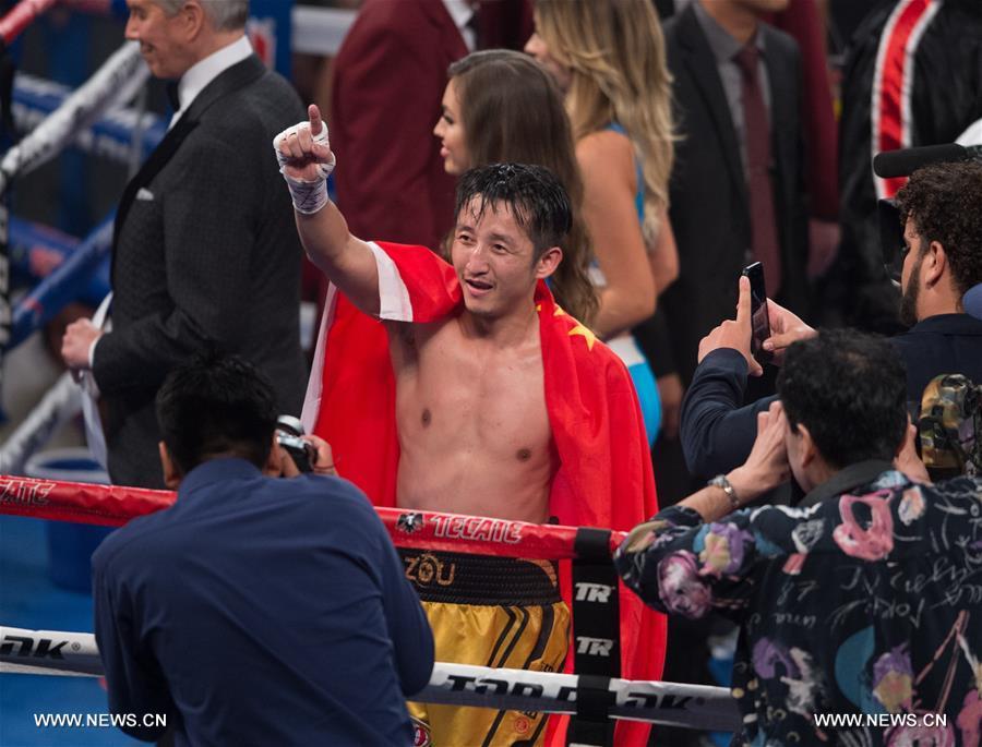 （体育）（1）拳击&mdash;&mdash;邹市明首夺世界拳王金腰带 实现拳击生涯&ldquo;全满贯&rdquo; 
