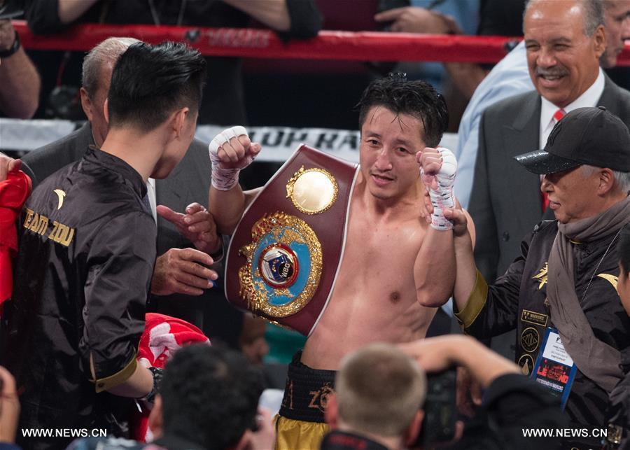 （体育）（2）拳击&mdash;&mdash;邹市明首夺世界拳王金腰带 实现拳击生涯&ldquo;全满贯&rdquo; 