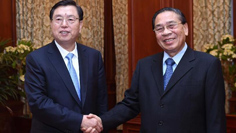 الصين ولاوس تتعهدان بتعزيز العلاقات بينهما
