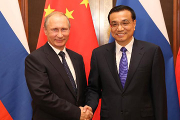 رئيس مجلس الدولة الصيني يلتقي مع بوتين