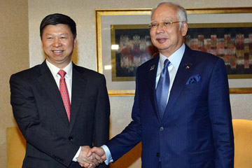 الحزب الشيوعي الصيني والمنظمة الوطنية المتحدة للمالايو يتعهدان بدفع التعاون بين الصين 
وماليزيا