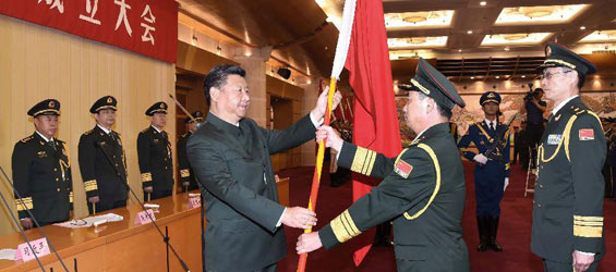 الصين تشكل قوة لوجستية مشتركة وشي يمنحها الأعلام