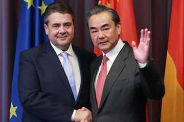 وزير الخارجية الصيني ونظيره الألماني يتعهدان بتعزيز النمو الاقتصادى العالمي معا