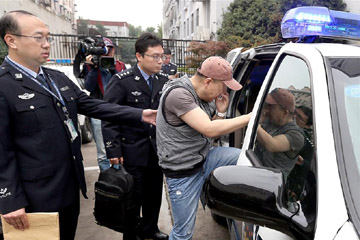 الشرطة الصينية تعيد هاربا امريكيا