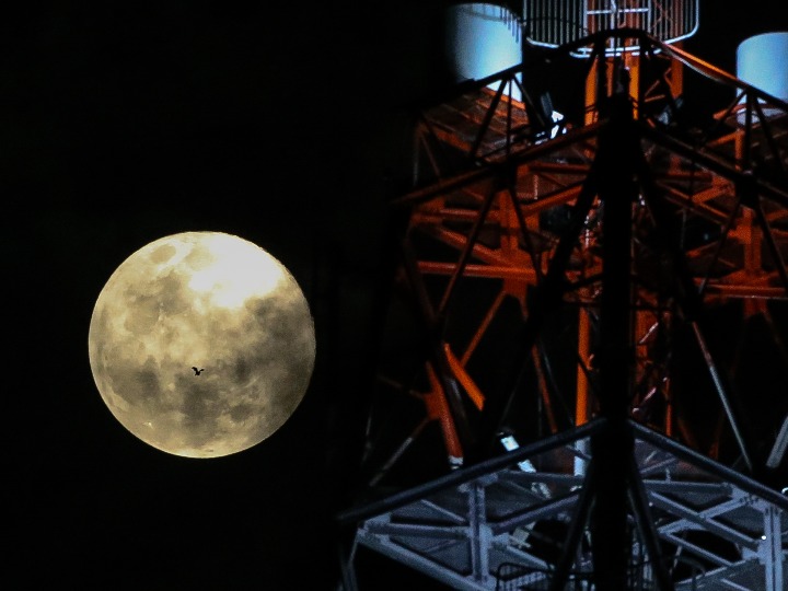 (وسائط متعددة) القمر العملاق فوق سماء مدينة كويزون